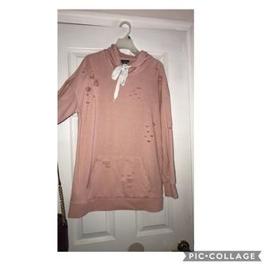 A pink distressed hoodie